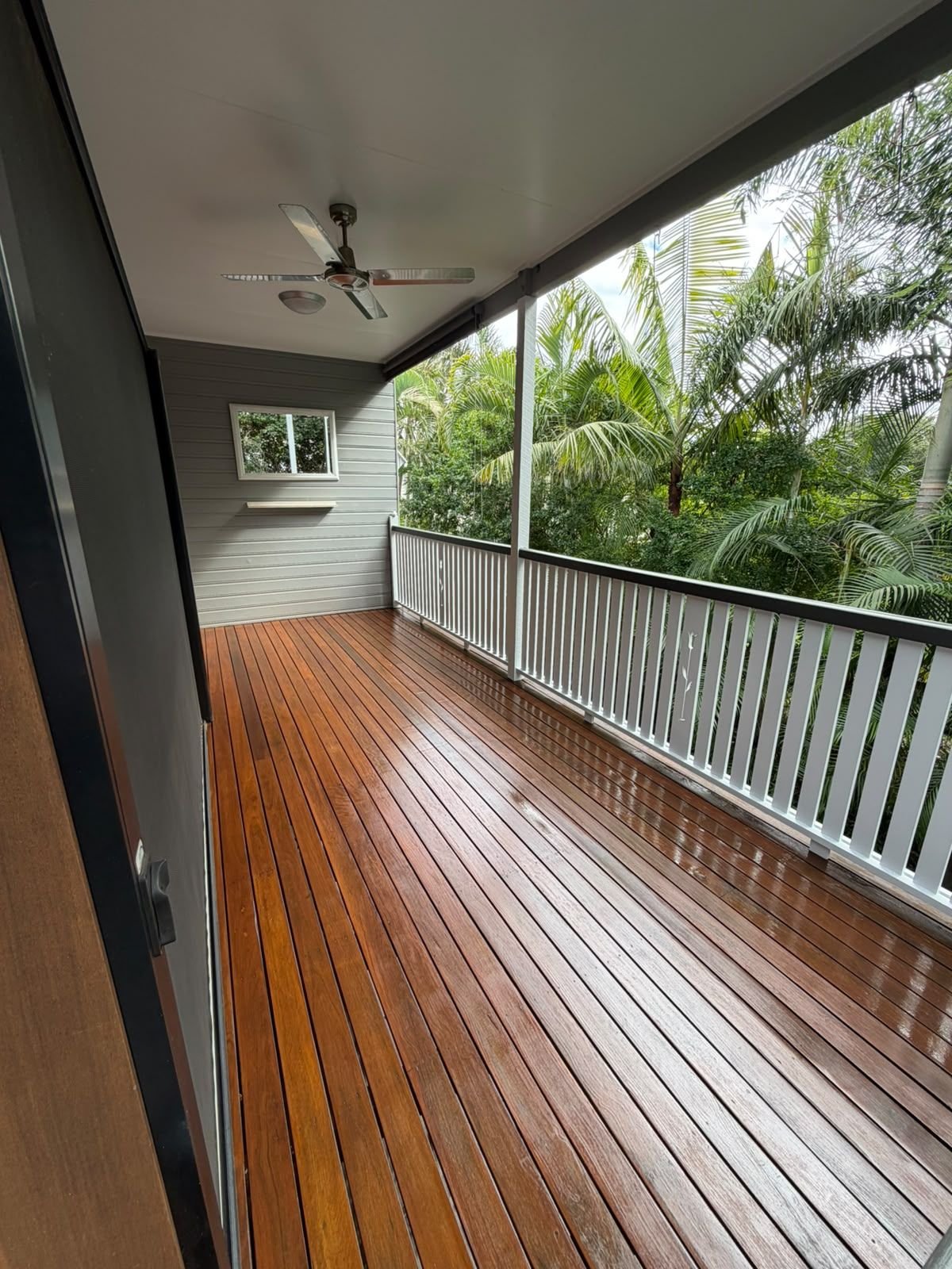 Wraparound timber verandah after restoration