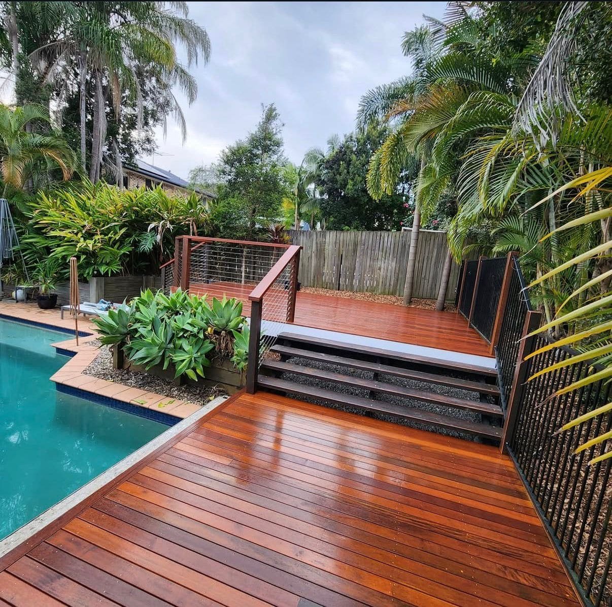 Poolside timber deck with cable balustrade