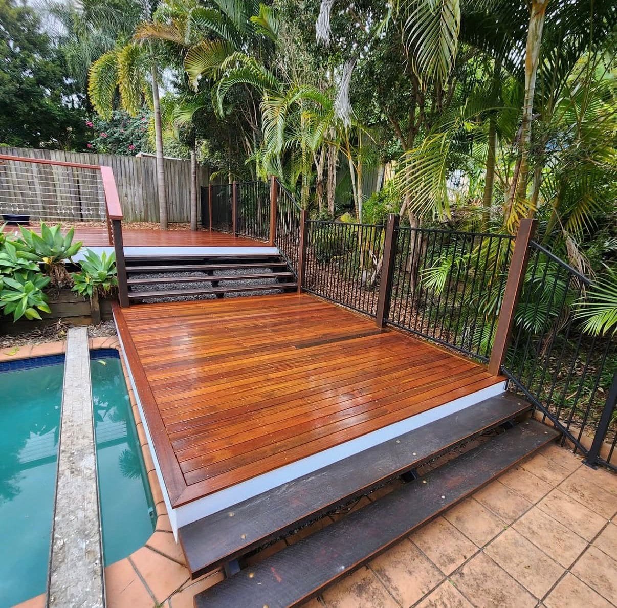 Raised timber deck with steps near pool