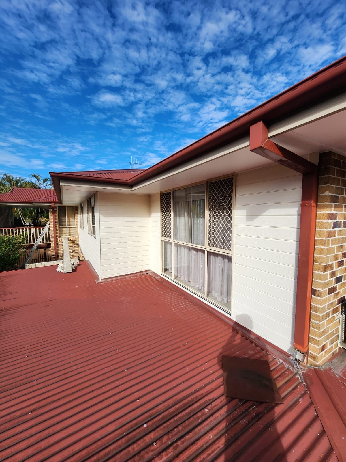 Brisbane home after exterior repaint and roof coating